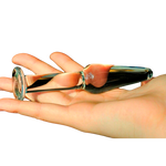 tapón anal Cristal fin en una mano